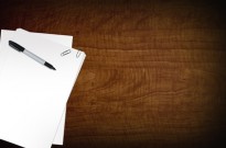 What to Consider Before Submitting a Grant Proposal Blank Papers on Desk
