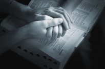 Holding Hands Over The Bible